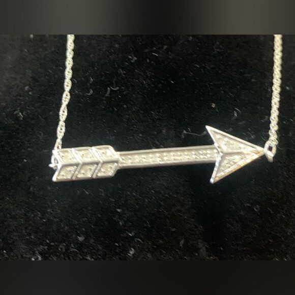 Sterling silver with .15 ctw diamonds. It’s a cute little cupids arrow. 16” - Picture 4 of 4